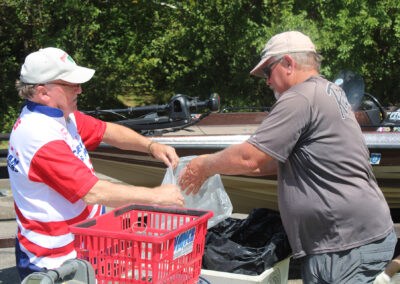 Barry Davis (on left) is the ABA Central Division Director which means he is the weighmaster at every tournament. He is weighing Karl Guegold's day 2 catch at Delaware Lake.