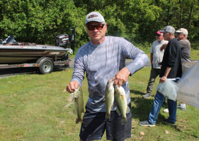 Tony Cannon displays three of the five bass he caught on the tournament's second day. His five bass limit allowed him to take first place for the two day event at Delaware Lake.