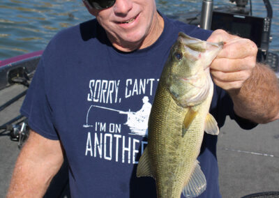 Catching bass wearing my favorite fishing t-shirt... which is any t-shirt I'm wearing on a fishing trip four days before November hits town.