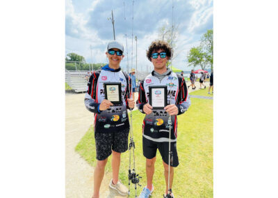 Hoyt Nicely (dark curly hair) and Connor Bower (in the hat) took first place in the Major League Fishing High School Team Tournament at Lake Guntersville in Alabama.