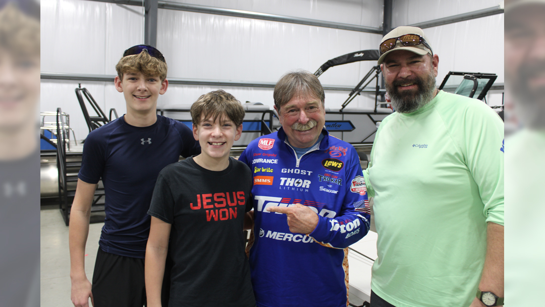 Posing at Vance Outdoors in Hebron, Ohio with pro angler Shaw Grigsby is the Camden family from Johnstown, Ohio. (L-R) Cohen Camden; Gabe Camden; Shaw; and Craig Camden, the boys' father.