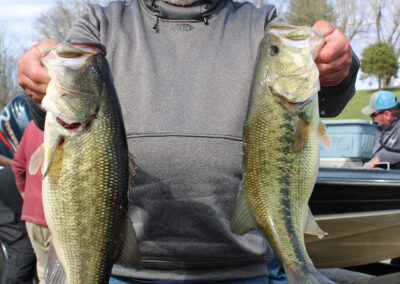Wes Clutter holds two of the five bass that led to his first place finish at Rocky Fork Lake.